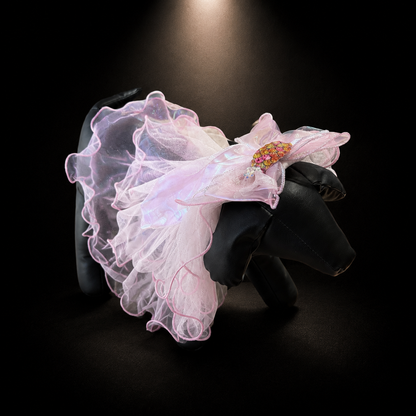 Pink tulle flower pet veil hair clip side view on black dog display form with sheer ruffles