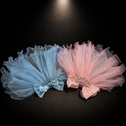 Pink and blue tulle pet veil headpieces displayed together with tiara and bow accents