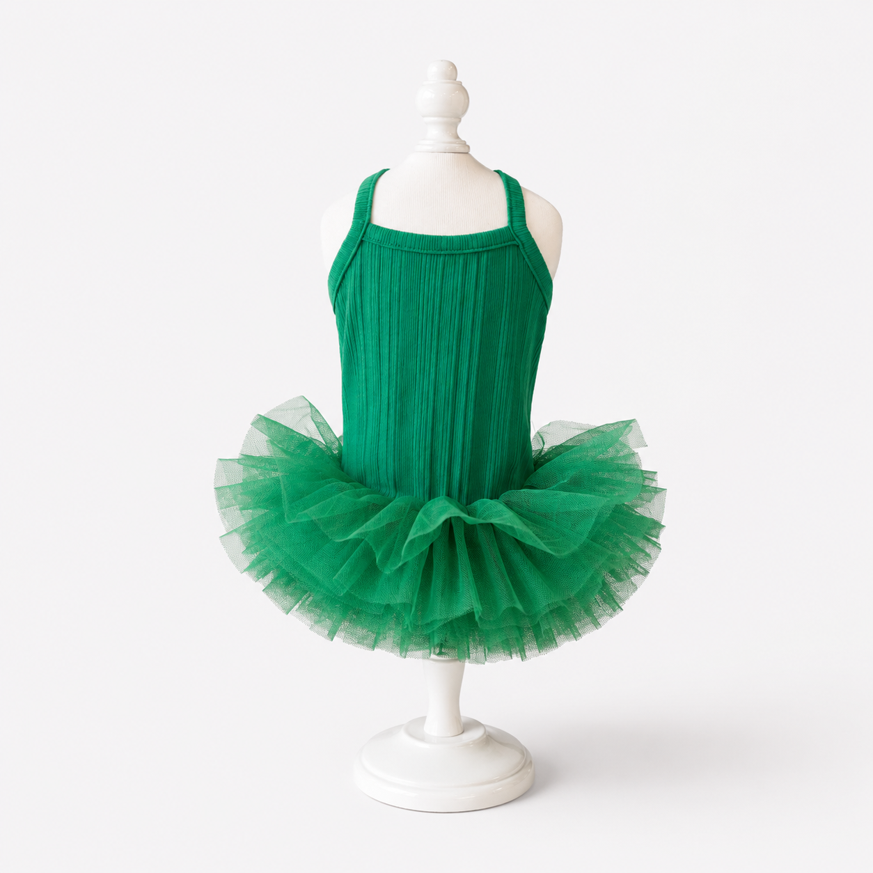 Green ribbed knit pet tutu dress displayed on mannequin with layered tulle skirt